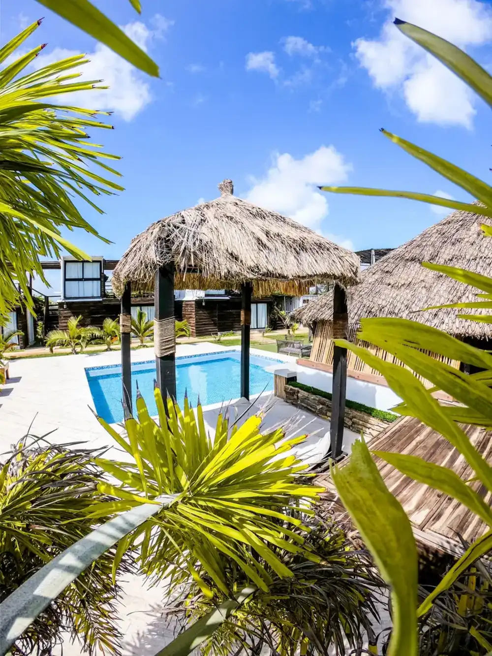 Thatched beachfront cabana by the pool
